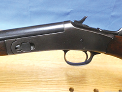 A close-up of a Harrington & Richardson 44 caliber shotgun.